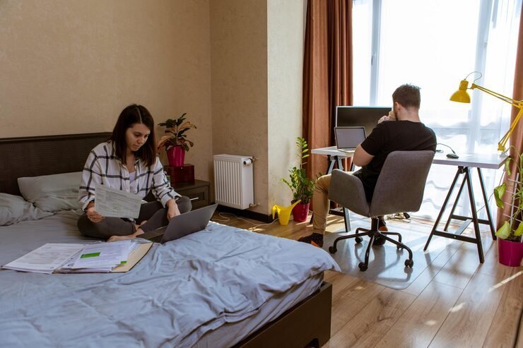 couple-working-home-home-isolation-woman-bed-man-office-chair-copy-space_259348-6150.jpg